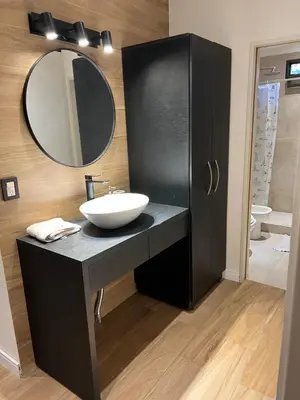 a bathroom with a sink and a mirror at MAGIC DPTO - GENERAL PAZ in Cordoba