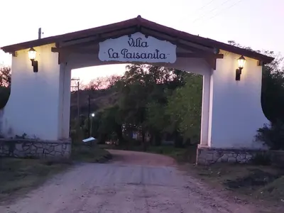 a gate to a road with a sign that reads mud in javascript at La Soñada II in Alta Gracia