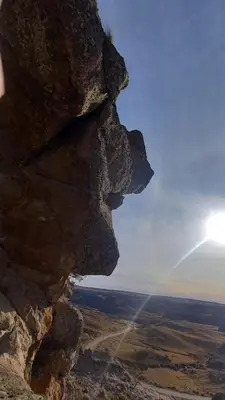 a view of the sun from a rock formation at La Francisca in La Carolina