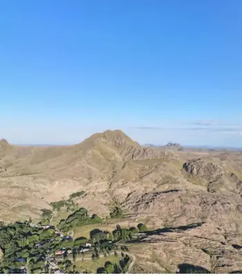 a view of a mountain with houses and trees on it at La Francisca in La Carolina
