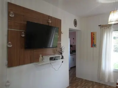 a living room with a flat screen tv on a wall at La Francisca in La Carolina