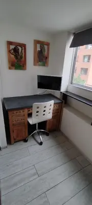 a desk in a room with a chair and a window at Semipiso 3 Dormitorios 2 Baños Nueva Córdoba in Cordoba