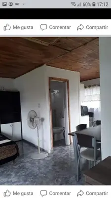 a picture of a room with a desk and a fan at WENDY Ranch in Falda del Carmen