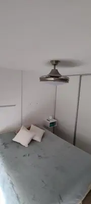 a white room with a bed with a ceiling at Departamento Alta Cordoba 