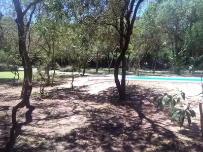 a park with trees and a swimming pool at Paraiso Serrano in La Población