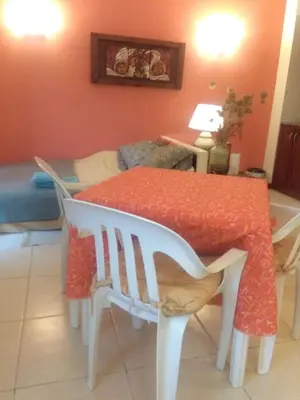 a dining room table with a red table cloth on it at Paraiso Serrano in La Población