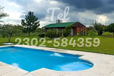 a sign for a swimming pool in front of a house at Cabaña El Escape, Potrero de Garay, B del LAgo,600m del lago in Potrero de Garay