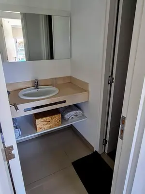 a bathroom with a sink and a mirror at Medilan Kempes Exclusivo in Cordoba