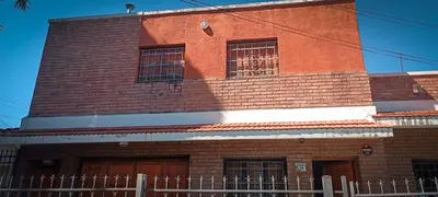 a red brick building with a fence in front of it at Departamento HOSPITAL PRIVADO - QUALITY - 