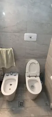 a bathroom with a toilet and a bidet at Departamento temporario pateto in Cordoba