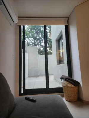 a window with a view of a courtyard outside at DPTO Catedralle Alta Cordoba PB in Cordoba