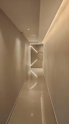 a hallway with a white wall and a wooden door at DPTO Catedralle Alta Cordoba PB in Cordoba