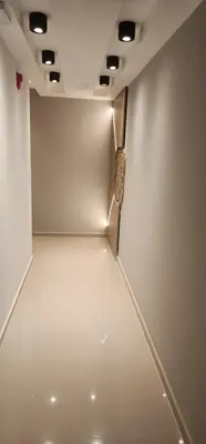 a room with a white wall with a metal object at DPTO Catedralle Alta Cordoba PB in Cordoba