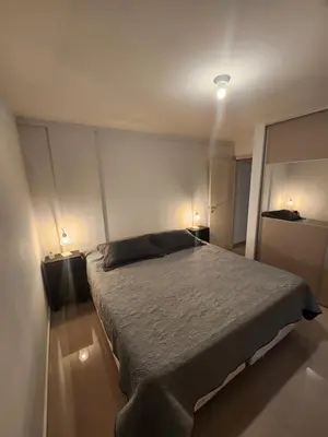 a bedroom with a bed with two lights on it at DPTO Catedralle Alta Cordoba PB in Cordoba