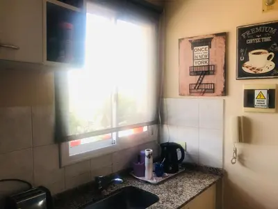 a kitchen counter with a sink and a window at NUEVOCENTRO 1 in Cordoba