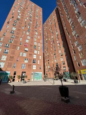 a large brick building with two large tall buildings at ALOHA Güemes Premium, Moderno dpto 1 dorm TORRES H in Cordoba