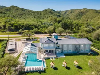 an aerial view of a house with a swimming pool at StradivariuS Hotel Boutique in Villa General Belgrano
