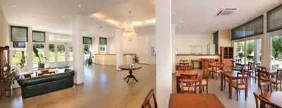 a lobby with a restaurant with tables and chairs at StradivariuS Hotel Boutique in Villa General Belgrano