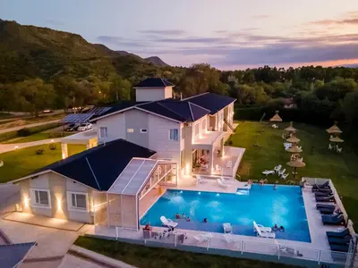 an aerial view of a house with a swimming pool at StradivariuS Hotel Boutique in Villa General Belgrano