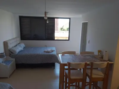 a room with a bed and a table and chairs at CiTriPio dpto con Aire acondiconado , wifi y TV in Cordoba