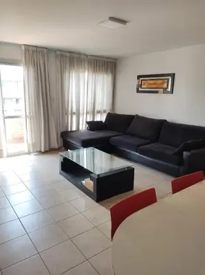 a living room with a couch and a coffee table at Piso entero en la mejor ubicación in Cordoba