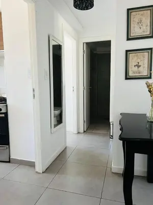 a hallway with a door leading to a kitchen at DEPARTAMENTO DE 1 DORMITORIO CON VISTA A LAS SIERRAS Av Colon 5034 in Cordoba