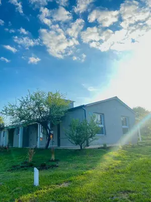 a house in a yard with at La Pasionaria casa de sierras in Santa Rosa de Calamuchita