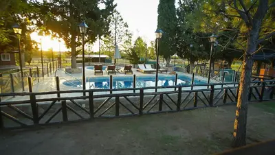 a large swimming pool in a park at Winds Hill Resort & Spa in Merlo