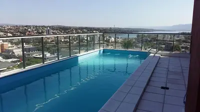 a large swimming pool on top of a building at Edificio Leonardo departamento 16 in Villa Carlos Paz