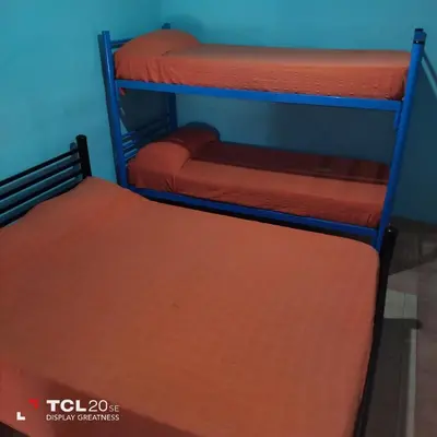 two bunk beds in a room with a bed at Pecas house in Mina Clavero