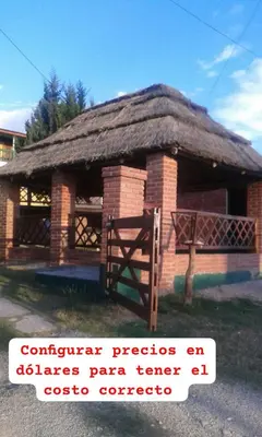 a small brick building with a grass roof at Pecas house in Mina Clavero