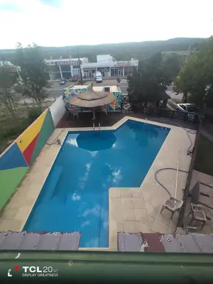 an overhead view of a swimming pool at a resort at Pecas house in Mina Clavero