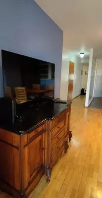 a living room with a large flat screen tv at Nueva Córdoba departamento de una habitacion con vista al Parque in Cordoba