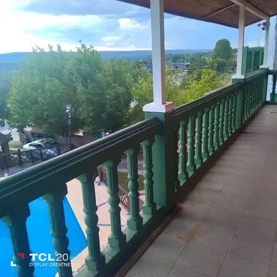 a balcony of a house with a view at Pecas house in Mina Clavero