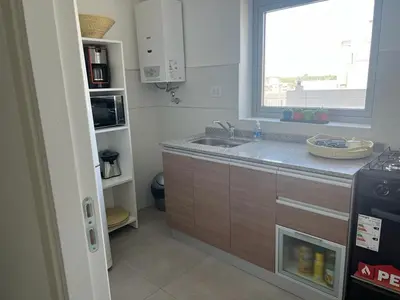 a small kitchen with a sink and a window at CIUDAD GAMA A ESTRENAR 9 E in Cordoba