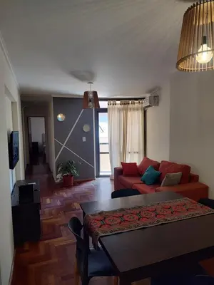 a living room with a couch and a table at Dpto dos dormitorios en Nueva Córdoba in Cordoba