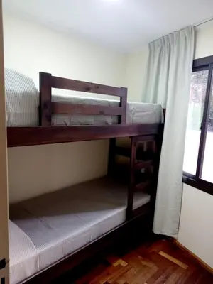 two bunk beds in a room with a window at Dpto dos dormitorios en Nueva Córdoba in Cordoba