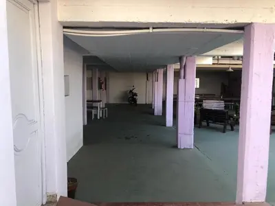 an empty room with purple pillars in a building at Wynwood Extreme Hostel in Villa Carlos Paz