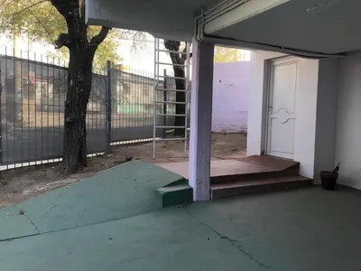 an empty building with a door and a porch at Wynwood Extreme Hostel in Villa Carlos Paz