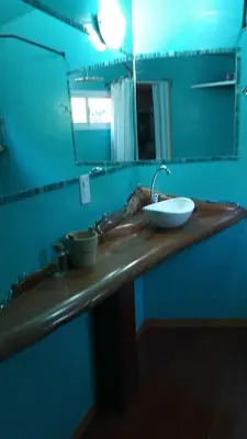 a bathroom counter with a sink and a mirror at Monoambiente Elegante in Los Hornillos