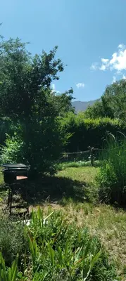 a park with a bench in the middle of a field at Monoambiente Elegante in Los Hornillos