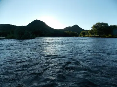 a view of a river with mountains in the background at La cabañita de Maco in Nono