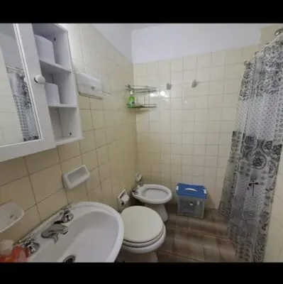 a bathroom with a sink and a toilet and a shower at Temporarios Cordoba in Cordoba