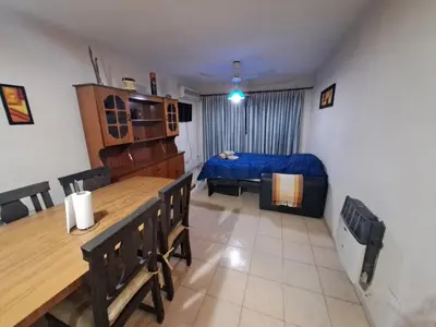 a room with a dining table and a bed in it at Temporarios Cordoba in Cordoba