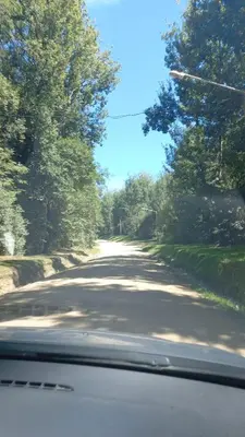 a view from a car of a road with trees at Sueños de Montaña in Villa Yacanto