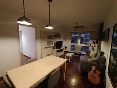 a living room with a table and a couch at ERA Residential Apartament in Cordoba