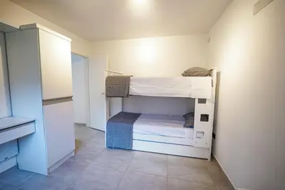 a small room with a bunk bed in it at Sunset Village in Villa Carlos Paz