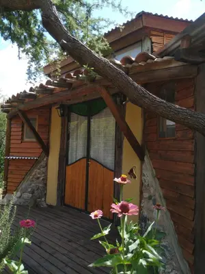 a house with a wooden door with flowers in front at Hexágono de San Javier in San Javier