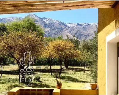 a view of the mountains from the window of a house at Color Local Cabañas in San Javier