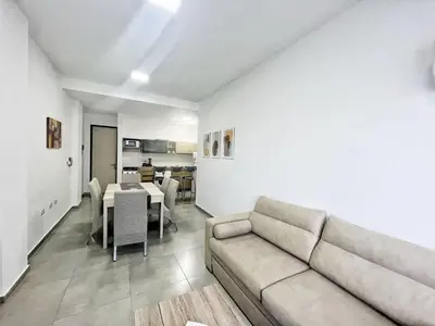 a living room with a couch and a table at Edificio Darwin in Villa Carlos Paz